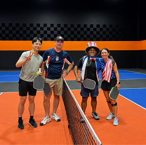Texas Pickleball doubles players competing during indoor pickleball match in Roanoke TX